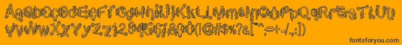 ShamanticsHollow-Schriftart – Schwarze Schriften auf orangefarbenem Hintergrund