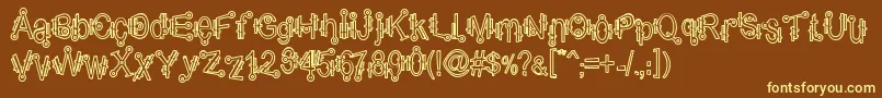 ShamanticsHollow-fontti – keltaiset fontit ruskealla taustalla