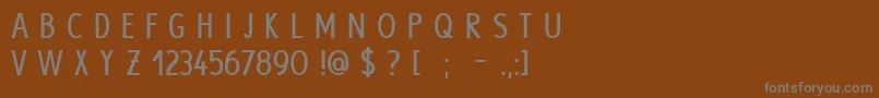 HypeBold-fontti – harmaat kirjasimet ruskealla taustalla
