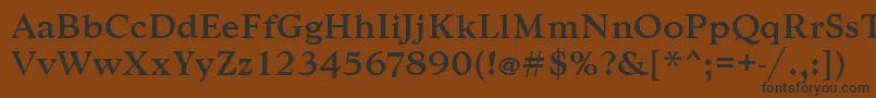 フォントGoudytmed – 黒い文字が茶色の背景にあります