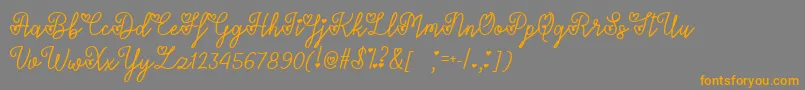 LoversInFebruaryTtf-Schriftart – Orangefarbene Schriften auf grauem Hintergrund