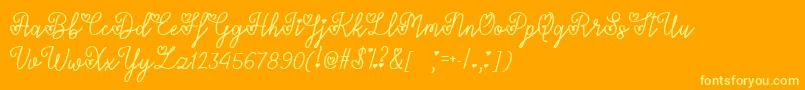 Czcionka LoversInFebruaryTtf – żółte czcionki na pomarańczowym tle