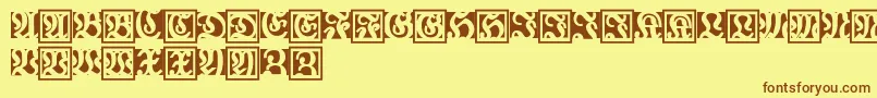 フォントFraxbrix – 茶色の文字が黄色の背景にあります。