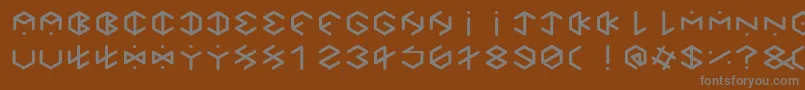 HexagonCupFontBold-fontti – harmaat kirjasimet ruskealla taustalla