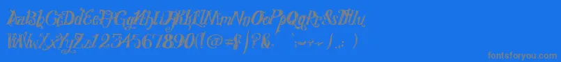 RoyalVanity-fontti – harmaat kirjasimet sinisellä taustalla