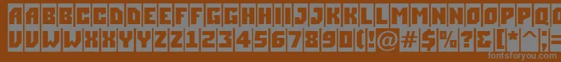 ASimplercm-fontti – harmaat kirjasimet ruskealla taustalla