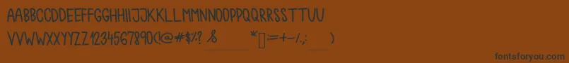 Chokoshtroko Font – Black Fonts on Brown Background