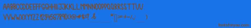 Chokoshtroko Font – Brown Fonts on Blue Background