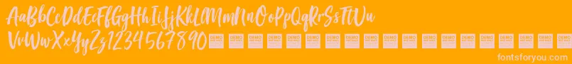 Czcionka GoodVibesDemo – różowe czcionki na pomarańczowym tle