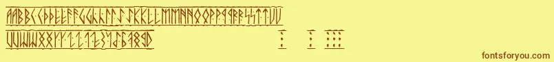 フォントRunic – 茶色の文字が黄色の背景にあります。