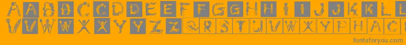 Childrensalphabetinvers-Schriftart – Graue Schriften auf orangefarbenem Hintergrund