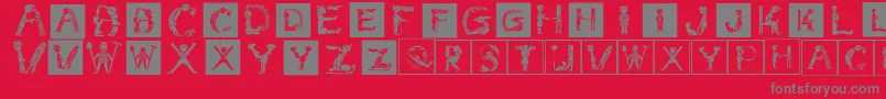 Childrensalphabetinvers-fontti – harmaat kirjasimet punaisella taustalla