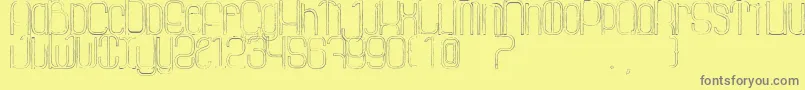 LaGrosseCochonneDefaced Font – Gray Fonts on Yellow Background