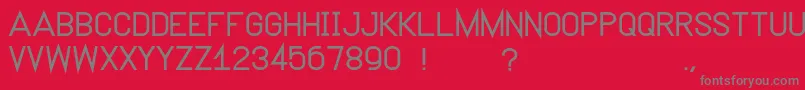 フォントNeutron – 赤い背景に灰色の文字