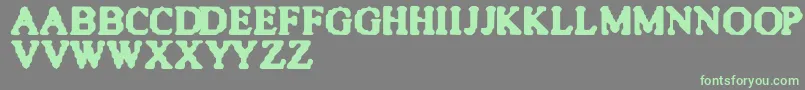 フォントQuiteBlunt – 灰色の背景に緑のフォント