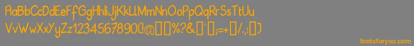 フォントBabil – オレンジの文字は灰色の背景にあります。