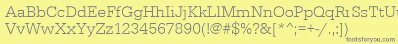 フォントSerifadeelig – 黄色の背景に灰色の文字