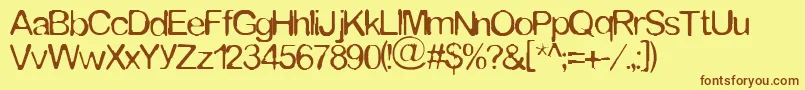 Tommytxtey Font – Brown Fonts on Yellow Background