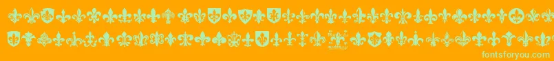 FleurDeLis-Schriftart – Grüne Schriften auf orangefarbenem Hintergrund