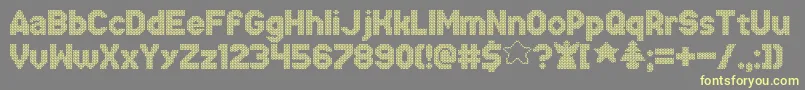 XmasSweaterStitch Font – Yellow Fonts on Gray Background