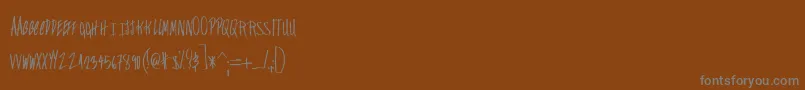 Czcionka Falconers – szare czcionki na brązowym tle