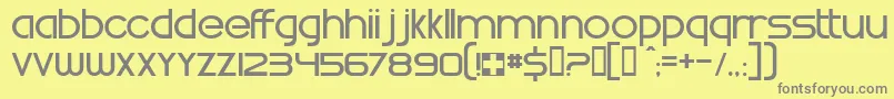 WhatTimeIsIt-fontti – harmaat kirjasimet keltaisella taustalla