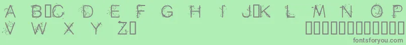 Cfflowersofdestinypersonal-fontti – harmaat kirjasimet vihreällä taustalla