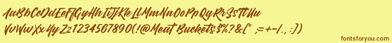 フォントMeatBuckets – 茶色の文字が黄色の背景にあります。