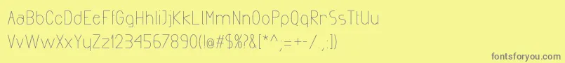 Fonte ExactaMedium – fontes cinzas em um fundo amarelo