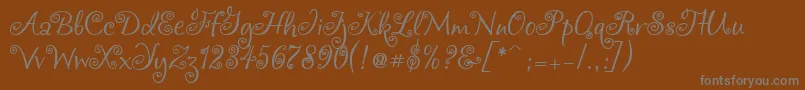 Chocogirl-fontti – harmaat kirjasimet ruskealla taustalla