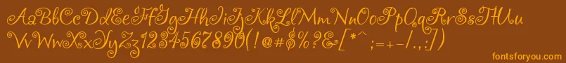 フォントChocogirl – オレンジ色の文字が茶色の背景にあります。