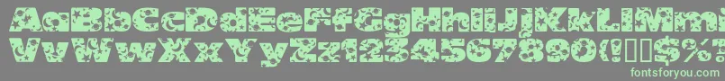 Fonte OhmygodStarsmoons – fontes verdes em um fundo cinza