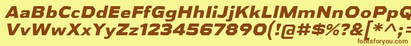フォントAthabascaExEbIt – 茶色の文字が黄色の背景にあります。