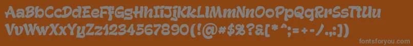 GeckoPersonaluseonly-fontti – harmaat kirjasimet ruskealla taustalla