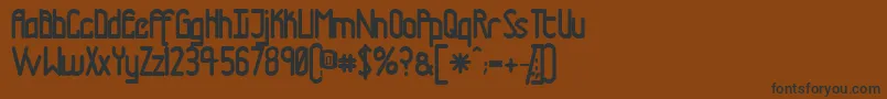 フォントTmTramwayNormal – 黒い文字が茶色の背景にあります