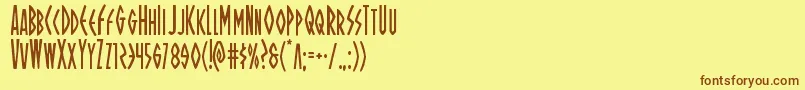 フォントOhmightyisiscond – 茶色の文字が黄色の背景にあります。