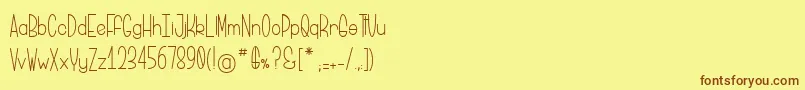 フォントBriocheAuPotiron – 茶色の文字が黄色の背景にあります。