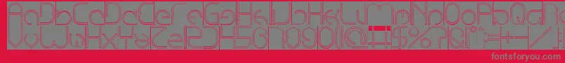 EmmiliaHollowInverse-Schriftart – Graue Schriften auf rotem Hintergrund
