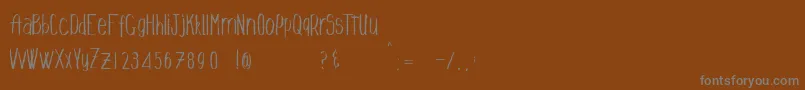 Talldrink Font – Gray Fonts on Brown Background