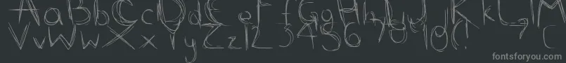 Fonte ScribbleScratch – fontes cinzas em um fundo preto