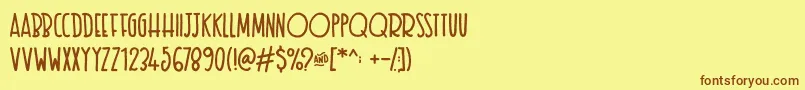 フォントTexastoast – 茶色の文字が黄色の背景にあります。