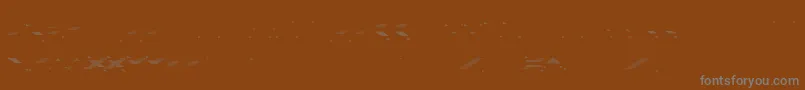 Czcionka VerminVibesOutOfInk – szare czcionki na brązowym tle