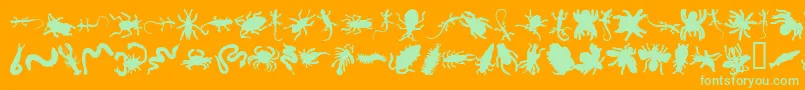 Czcionka Anncrawl – zielone czcionki na pomarańczowym tle