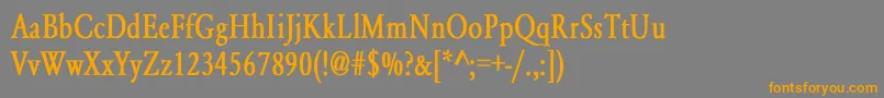 フォントYearlindNormalCondensedBold – オレンジの文字は灰色の背景にあります。