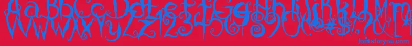 CoralinesCat Font – Blue Fonts on Red Background