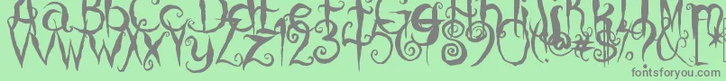 CoralinesCat Font – Gray Fonts on Green Background