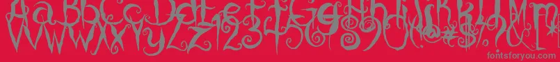 CoralinesCat-Schriftart – Graue Schriften auf rotem Hintergrund