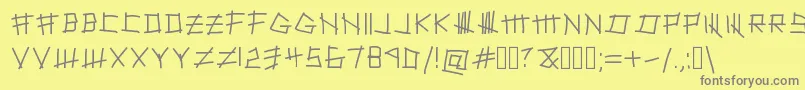 SilenceWillFall-Schriftart – Graue Schriften auf gelbem Hintergrund