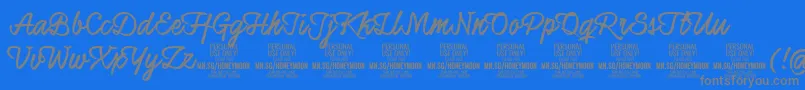 HoneymoonupboldPersonal-Schriftart – Graue Schriften auf blauem Hintergrund