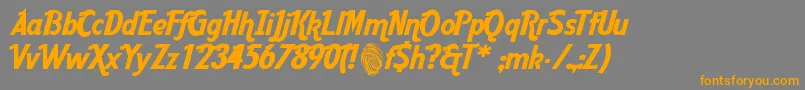 フォントAardc – オレンジの文字は灰色の背景にあります。